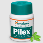 A white bottle featuring a teal cap, labeled Himalaya Pilex Tablet 60, is positioned beside a small green plant leaf.