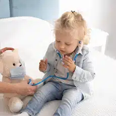 cute-child-with-toy-stethoscope-home-quarantine