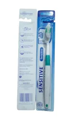 Soft toothbrush with flexible neck and tongue cleaner