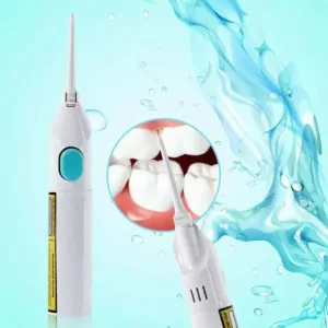 Rechargeable oral irrigator being used along the gumline