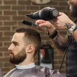 Beard styling brush with soft duster side for cut hair removal