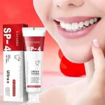 Probiotic whitening toothpaste tube in red and white packaging